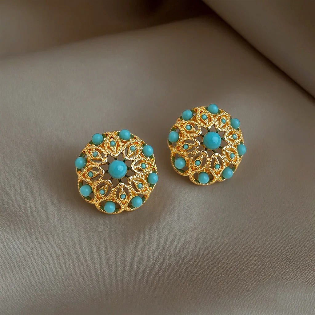 Vintage geometric round turquoise stud earrings flat lay