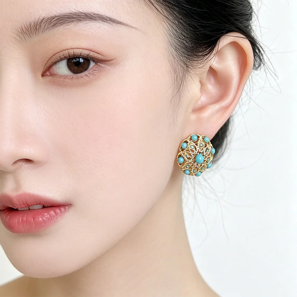 Vintage turquoise stud earrings worn on model